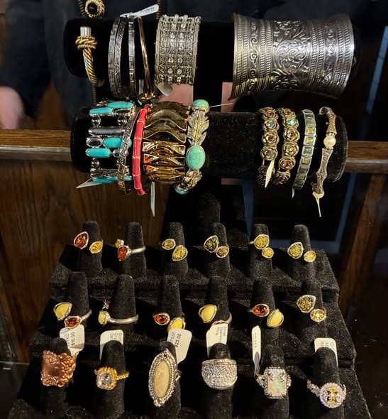 Rings, earrings and cuff bracelets on display